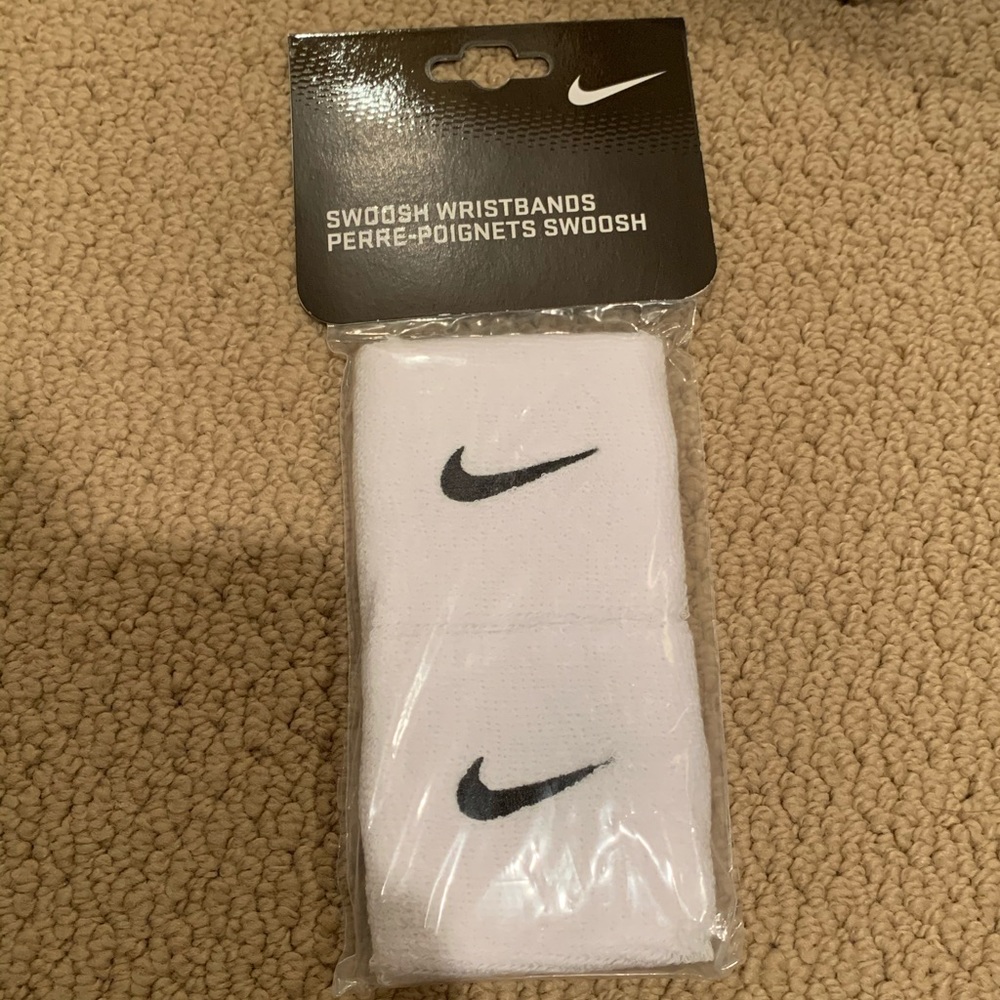 White nike swoosh wristbands